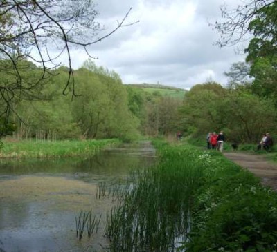 Photo of Cromford Canal with walkers on towpath